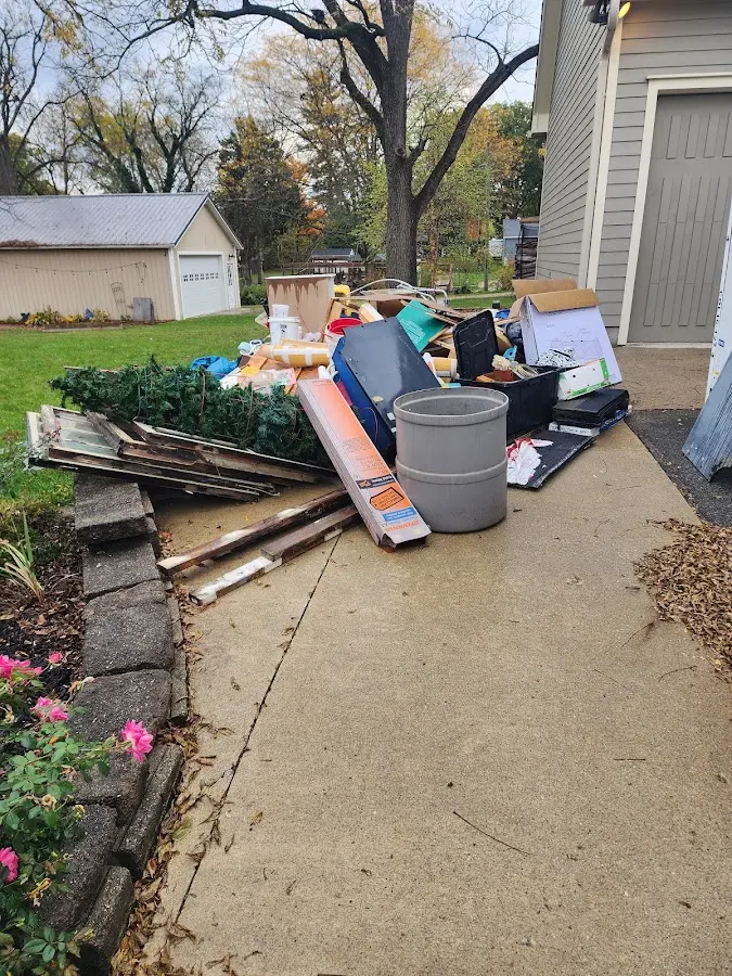 Dumpster being loaded with debris for Roofing Dumpster Rental in Mount Vista